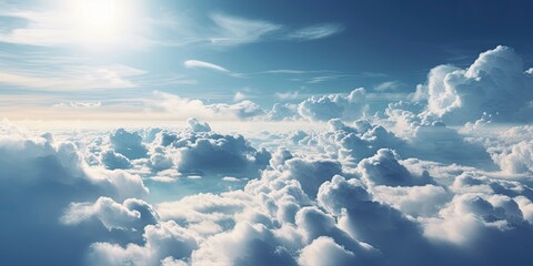 Beautiful pastel cloudscape. Fluffy clouds in the sky. Horizon from a plane. Weather and overcast dawn.