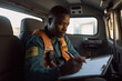 © wetzkaz - Black African American EMS Professional Paramedic on the Way to Hospital. Generative AI