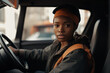 © wetzkaz - african-american female courier, drives a truck or bus. Generative AI