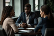 © wetzkaz - african american man in a suit communicates with two female people in an office or house, consulting or sharing a news. Generative AI