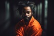 © ChaoticMind - Prisoner in an Orange Suit sitting in prison. Generative Ai