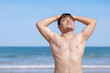 © ADDICTIVE STOCK - Glad shirtless gay on beach