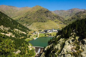 summer view of mountain resort, sanctuary and reservoir in catalan valley of vall de nuria in pyrene