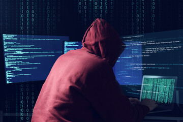 Cyber attack. Anonymous hacker working with laptop and monitors on dark blue background. Binary code around him