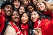 © Six Hen Media - Group of people, multiracial, friends, huddled together for a selfie, wearing red for Christmas celebrations.