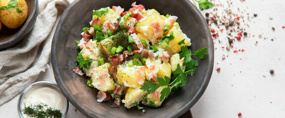 Wall Mural - Kartoffelsalat - traditional German potato salad. Potato salad with bacon.