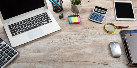 Poster - Laptop, blank notepad, pen calculator, reminder  flower on office table