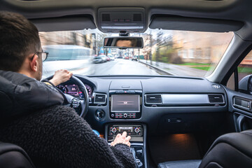 Wall Mural - Hands on the wheel when driving at high speed from inside the car.