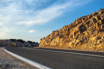 Wall Mural - An asphalt road running past a beautiful viewpoint on the Island of Pag,Croatia.