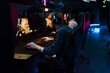 © Drobot Dean - Team of gamers playing online game on tournament in cybersport club