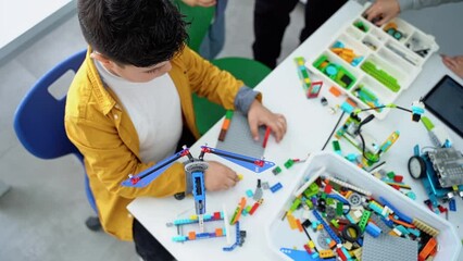 Wall Mural - robotics programming class. children construct and code robot. stem education using constructor bloc