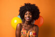 © Nedrofly - A woman with an afro standing in front of balloons
