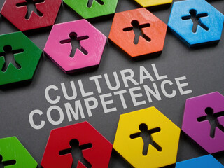 Cultural competence sign and small colorful figurines.