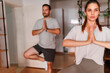 © Impact Photography - Couple practicing yoga at home