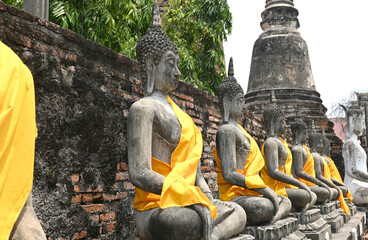 Wall Mural - Row of Buddha statues at the temple in Ayutthaya, Thailand