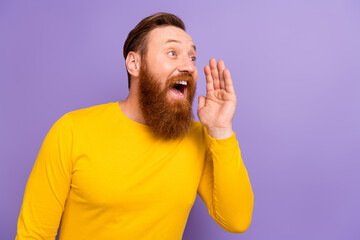 Wall Mural - Photo of young funny scream promoter guy wear yellow shirt hand cheek rumor look empty space fresh news isolated on violet color background