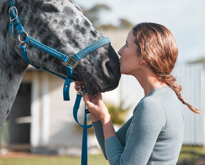 Poster - I love him so. an attractive woman being affection with a horse on a farm.