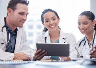 Poster - This is such great news. a group of doctors having a staff meeting while using a digital tablet.