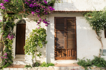 Wall Mural - Beautiful Mediterranean street view, Italy, italian facade with flowers in old town