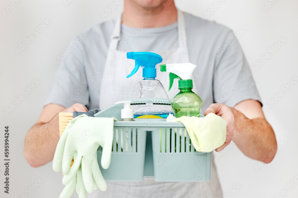Youve been served, some extra safety. an unrecognisable man holding a basket full of cleaning supplies.