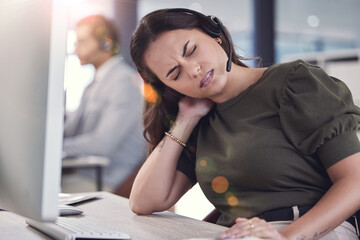 Poster - Neck pain is so uncomfortable. a young male call center agent suffering from neck pain at work.