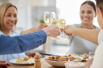 Sticker - Heres to our family. a family toasting with wine while having lunch together at home.