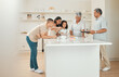 © K Davis/peopleimages.com - Spending quality time together. three generations of a family baking together.