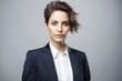 Group portrait photography of a tender woman in her 30s wearing a sleek suit against a white background. Generative AI