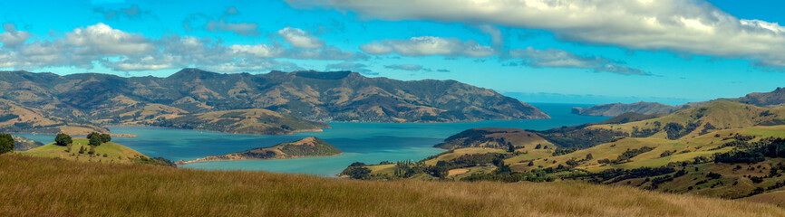 Wall Mural - Akaroa on Banks Peninsula in the Canterbury Region of the South Island of New Zealand. The area was also named Port Louis-Philippe by French settlers after the reigning French king Louis Philippe I