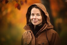 Pet Portrait Photography Of A Grinning Woman In Her 30s Wearing A Warm Parka Against An Autumn Foliage Background. Generative AI