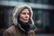 © Robert MEYNER - Pet portrait photography of a satisfied woman in her 40s wearing a warm parka against a modern architectural background. Generative AI