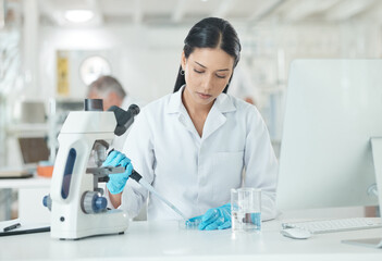 Wall Mural - setting up for a new clinical trial. a young scientist working with samples in a lab.