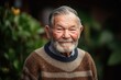 © Robert MEYNER - Portrait of an elderly man with grey hair in the garden.
