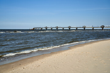 Wall Mural - Concrete pier on a sandy beach by the Baltic Sea in Miedzyzdroje