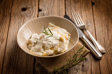 Wall Mural - ravioli with parmesan cheese and herbs