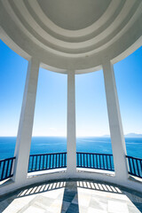 Wall Mural - Scenic view of Mediterranean Sea and Greek islands seen through columns of a rotunda.