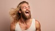 Portrait of a fictional handsome nordic man with long blonde hair and a beard laughing candidly. Isolated on a plain background. Generative AI illustration.