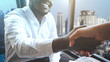 © arrowsmith2 - African business man and asian man shaking hands after agreeing to sign a contract to do business together.Businessmen of different nationalities shaking hands in a business office in the city
