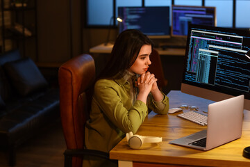 Young female programmer working in office