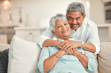 Wall Mural - The only thing that never aged is our love. a happy senior couple relaxing on the sofa at home.