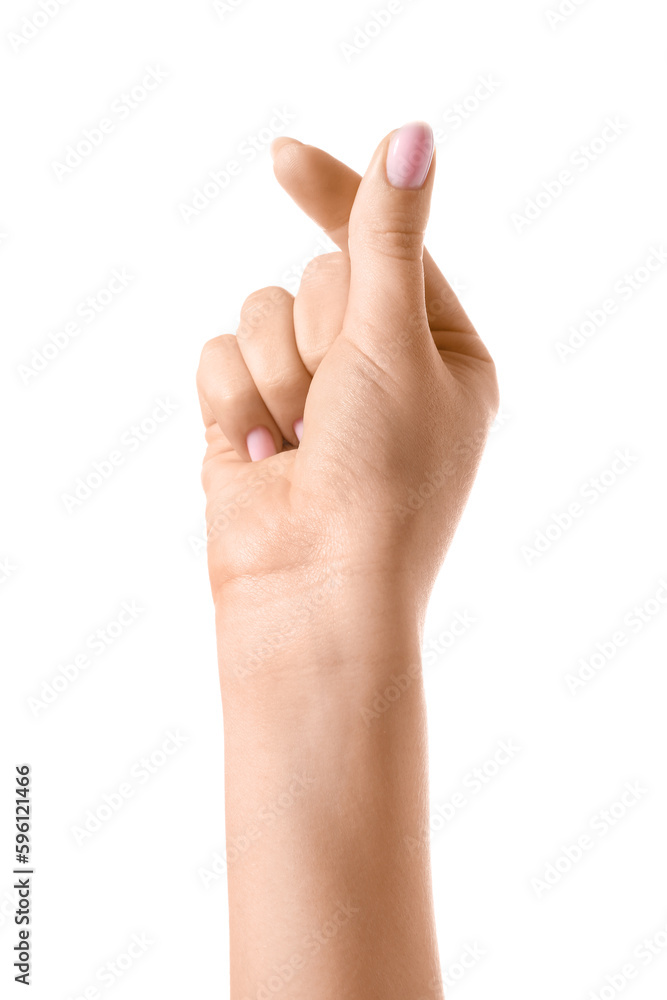 Woman making heart with her fingers on white background