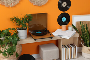 Wall Mural - Stylish turntable with vinyl record on console table in cozy room