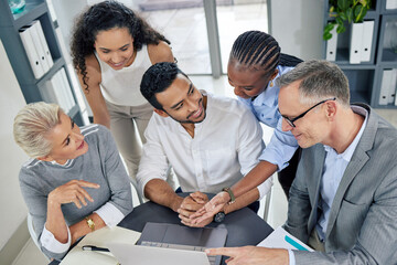 Sticker - Going above and beyond to make their plans work. a group of businesspeople using a laptop together in an office.