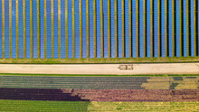 Fields With Country Road Passing Through Farming Lands And Solar Panel Field In Southern California, Aerial View.