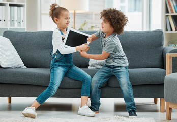 but its my turn. two siblings fighting in a game of tug of war over their digital tablet.