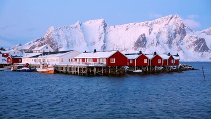 Wall Mural - spectacular winter view of popular tourist destination - lofoten islands archipelago. red houses on 