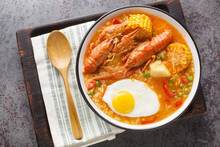 Crayfish Soup With Tomatoes, Corn, Pepper, Potato And Egg Close-up In A Bowl On The Table. Horizontal Top View From Above