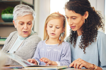 Wall Mural - Grandmother, mama and girl reading a book, bonding and happiness for fun, quality time and relax. Family, parent or granny with mom, daughter or female child with storytelling, literature or learning