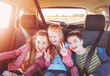 © candy1812 - Group of three children sitting in the car
