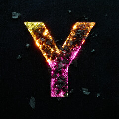 High quality photo of multicolored gradient neon colors capital letter Y on black textured background with black stones.